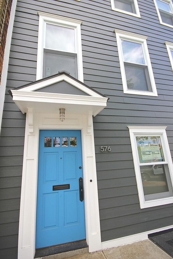 HardiePhotos Submission: contractor_name: Premier Building and Renovations comments: This James Hardie Siding project took place in Brooklyn, NY. The color choice of this project was James Hardie's Iron Gray. Every window was replaced and a beautiful blue door was added to make this Brooklyn home really stand out. The owners were very happy with there newly renovated Brooklyn home. products: HardiePlank, HardieTrim, HardieSoffit colors: Arctic White, Iron Gray