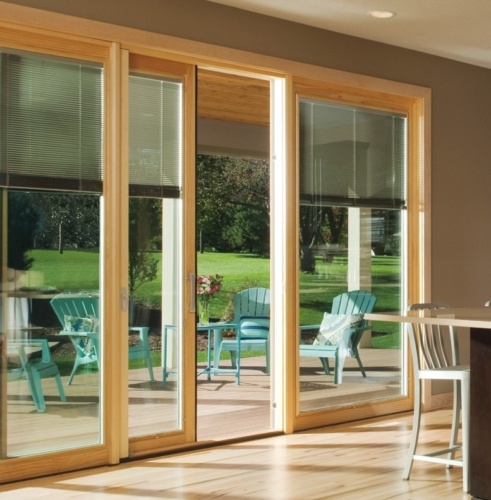 sliding patio doors with a view of patio furniture outside