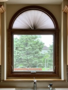 an awning style vinyl window over a kitchen sink